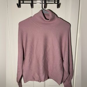 Dusty pink ribbed turtleneck sweater
